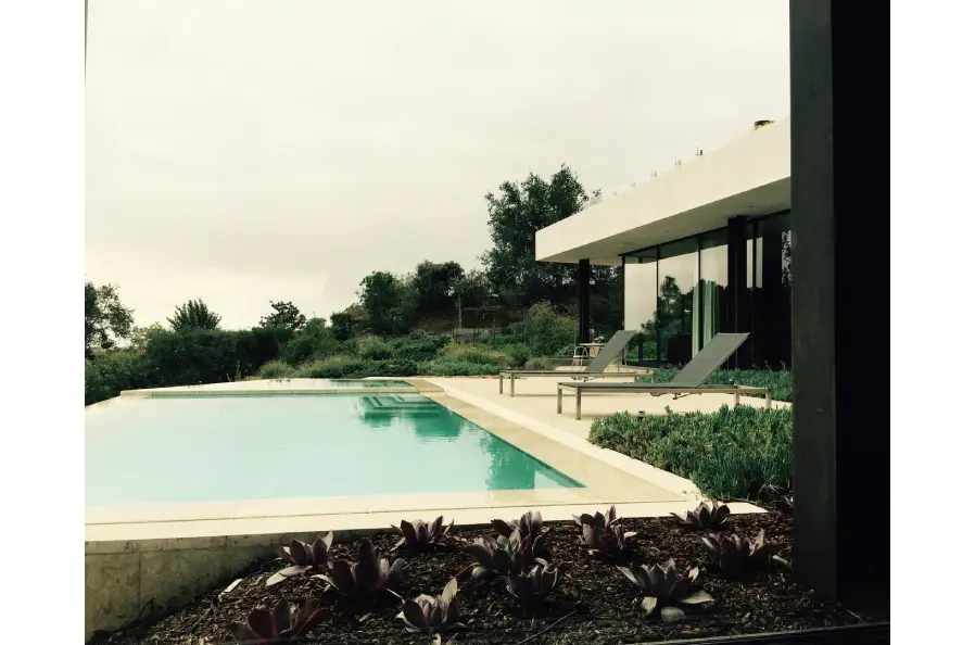 Modern home with bright pool and garden.