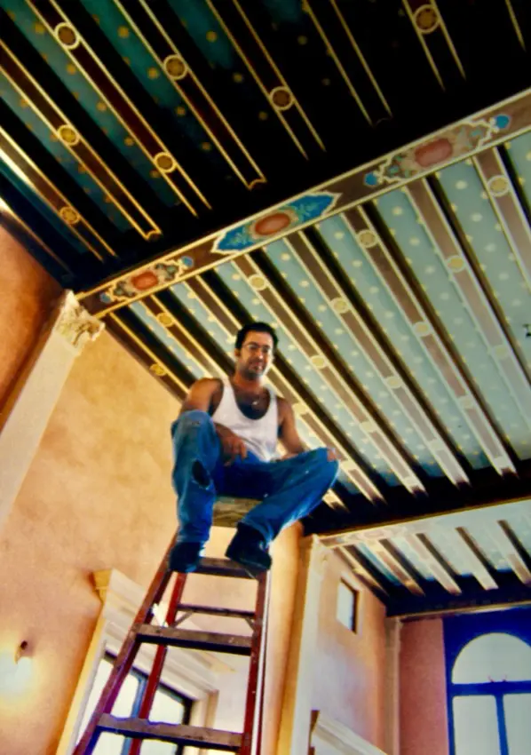 Joe Nicoletti painting a ceiling
